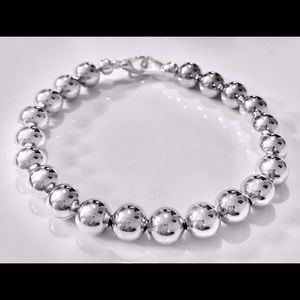 Silver beaded stretch bracelet.